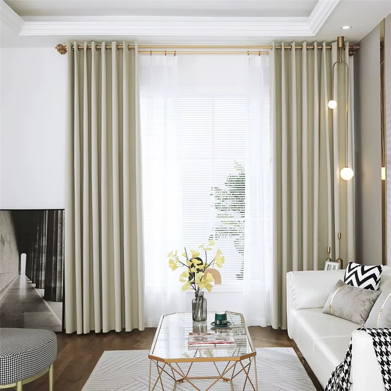 Blackout curtains in a light beige shade, adding a touch of elegance and privacy to a modern living room