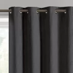 dark gray blackout curtain showing the grommet top and textured fabric