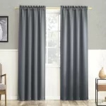 gray thermal blackout curtains hanging on a rod in a living room